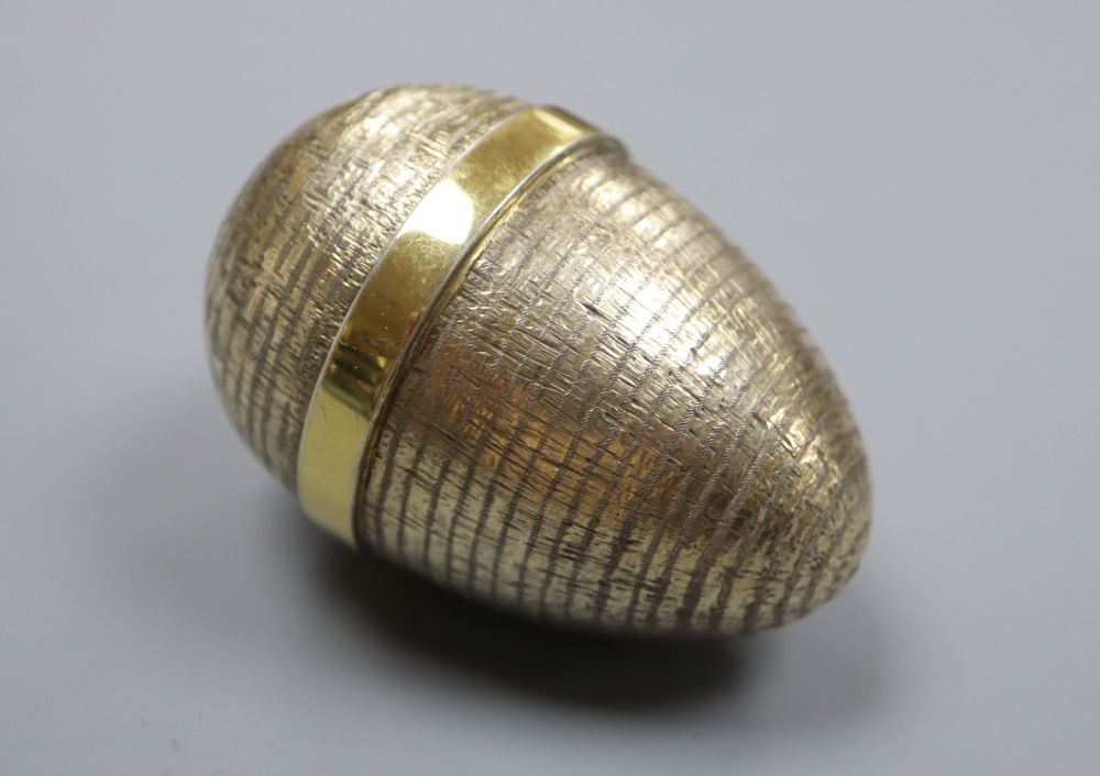 A modern textured silver gilt surprise egg by Stuart Devlin, London, 1985, opening to reveal a marlin, 72mm, gross, 117 grams.